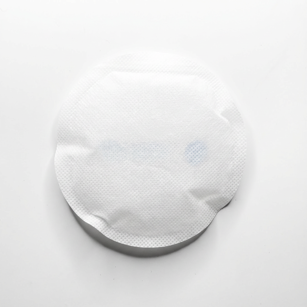 Soft fabric backing on 4-inch round medical ice pack for patient comfort