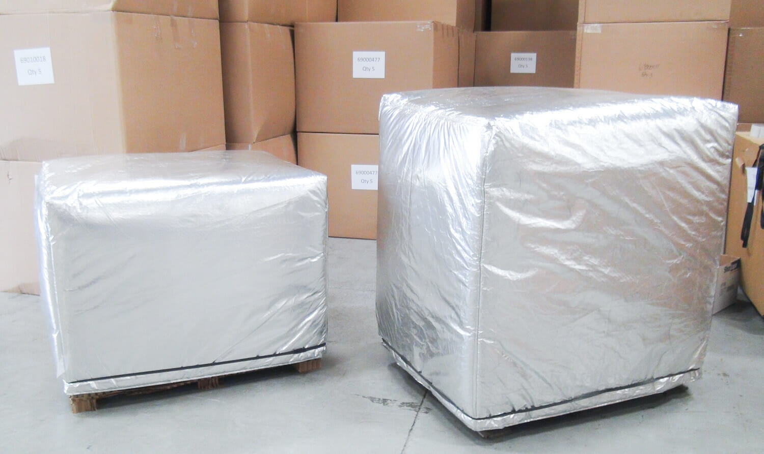 Reference pallet covers fitted to two different load heights
